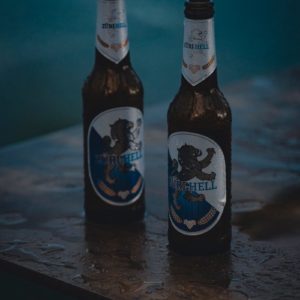 a couple of beer bottles on a table